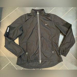 Nike lightweight jacket, with reflective material.  Size large, Black. EUC.